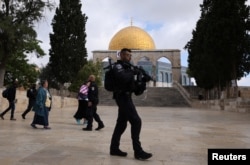 Israeli security forces secure the area at the compound that houses Al-Aqsa Mosque, known to Muslims as Noble Sanctuary and to Jews as Temple Mount, in Jerusalem's Old City, May 5, 2022.
