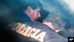 Peru's ousted President Pedro Castillo is escorted by police at the police station where he was being held in Lima, Wednesday, December 7, 2022. (Renato Pajuelo/AP)