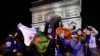 Fans with Moroccan, right, and Algerian flags gather in Paris, France, for the Morocco v Portugal match at the World Cup in Qatar, Dec. 10, 2022.
