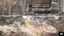 A Cambodian army soldier sits at damaged Cambodia's 11th century Hindu Preah Vihear temple, file photo. 