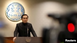 FILE - Thai Prime Minister Prayuth Chan-ocha attends a news conference as the junta marked the third anniversary of a military coup in Bangkok, May 23, 2017. 