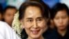 FILE - In this Dec. 14, 2018, file photo, ousted Myanmar leader Aung San Suu Kyi arrives to attend the Myanmar Entrepreneurship Summit at the Myanmar International Convention Center in Naypyidaw, Myanmar.