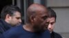 Frank James, suspect dans la fusillade dans une station de métro de Brooklyn, est escorté par la police après avoir été arrêté à New York, aux États-Unis, le 13 avril 2022.