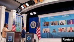 President Joe Biden and US Ambassador to the UN Linda Thomas-Greenfield participate in a virtual COVID-19 Summit as part of the UN General Assembly (UNGA) from the South Court Auditorium in the White House complex in Washington, Sept. 22, 2021. 