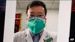 This image from video, shows a selfie of Dr. Li Wenliang. The Chinese doctor who got in trouble with authorities in the communist country for sounding an early warning about the coronavirus outbreak died Friday, Feb. 7, 2020, after coming down with…