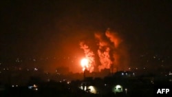 Flames and smoke rise during Israeli airstrikes central Gaza strip in on Apr. 21, 2022. 