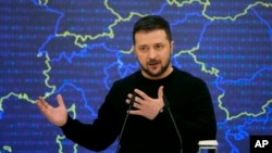 FILE - Ukrainian President Volodymyr Zelenskyy addresses the media after a EU-Ukraine summit in Kyiv, Ukraine, Feb. 3, 2023. Reports suggest Zelenskyy may attend this week's European Union summit in Brussels.