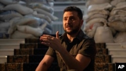 Ukrainian President Volodymyr Zelenskyy speaks during an interview with The Associated Press in his office in Kyiv, Ukraine, April 9, 2022.