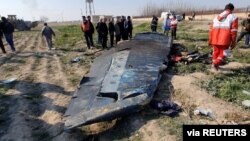 A general view of the debris of the Ukraine International Airlines, flight PS752, Boeing 737-800 plane on the outskirts of Tehran, Jan. 8, 2020, is seen in this screen grab obtained from a social media video via Reuters.