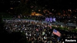 FILE - Anti-government demonstrators march in protest against the invocation of the emergency laws in Hong Kong, China, Oct. 14, 2019. 