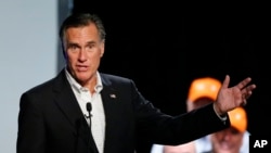 Former Republican presidential nominee Mitt Romney introduces Republican U.S. Rep. Mia Love, of Utah, during a campaign rally, Aug. 24, 2018, in Lehi, Utah.