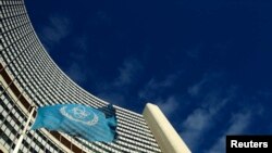FILE - The flag of the International Atomic Energy Agency (IAEA) flies in front of its headquarters in Vienna. 