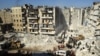 ဆီးရီးယားနိုင်ငံမြောက်ပိုင်း အလက်ပို (Aleppo) မြို့မှာ ငလျင်ဒဏ်သင့်အပျက်အစီးတွေကြား ဆီးရီးယားစစ်သားများက ကယ်ဆယ်ရေးလုပ်ဆောင်နေစဉ် (ဖေော်ဝါရီ ၉ ၊ ၂၀၂၃)