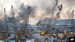 FILE - Aftermath of a massive explosion is seen in in Beirut, Lebanon, Aug. 4, 2020.
