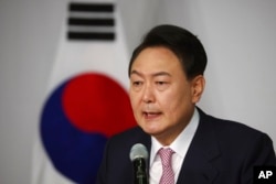 South Korea's president-elect Yoon Suk Yeol speaks during a news conference at the National Assembly in Seoul, South Korea, March 10, 2022.