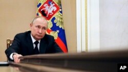 Russian President Vladimir Putin chairs a meeting with members of the government via teleconference in Moscow, March 10, 2022.