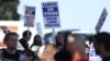 FILE - Academic workers at UC San Diego walk out as thousands of employees at the University of California campuses have go on strike in an effort to secure improved pay and working conditions in San Diego, Nov. 14, 2022.