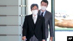 FILE - Minister of Internal Affairs Minoru Terada arrives at the prime minister's office in Tokyo, Japan, Aug. 10, 2022. 