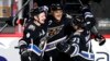 Washington Capitals left wing Alex Ovechkin (8) celebrates his goal with defenseman Dmitry Orlov (9) and left wing Conor Sheary (73) during the third period of an NHL hockey game against the Winnipeg Jets, Dec. 23, 2022, in Washington.