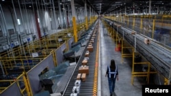 Packages ready to be delivered are seen during Cyber Monday at the Amazon fulfilment center in Robbinsville Township in New Jersey, Nov. 28, 2022. 