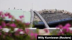 DPR RI mengesahkan Undang-Undang Perjanjian Ekstradisi Bilateral dengan Singapura dan juga meloloskan Undang-Undang Pengembangan dan Penguatan Sektor Keuangan (PPSK) pada Kamis (15/12). (Foto: REUTERS/Willy Kurniawan)