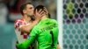 Borna Barisic, left, congratulates his teammate and goalkeeper Dominik Livakovic after Croatia defeated Japan on penalty kicks during the World Cup round of 16 soccer match at the Al Janoub Stadium in Al Wakrah, Qatar, Dec. 5, 2022. 