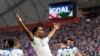 Jude Bellingham celebrates after scoring England's opening goal during the World Cup group B soccer match between England and Iran at the Khalifa International Stadium in Doha, Qatar, Nov. 21, 2022. 