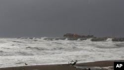 Waves from the Bering Sea splash up on a jetty in Nome, Alaska, Sept. 16, 2022.