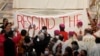 Indigenous Canadians display a banner calling on Pope to rescind the Doctrine of Discovery in Quebec City, Canada, Thursday, July 28, 2022.