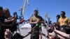 Lider samoproglašenje Donjecke Narodne Republike (DNR) Denis Pušlin obraća se novinarima u luci u Mariupolju, 12. juna 2022, Foto: AFP/Yuri Kadobnov)