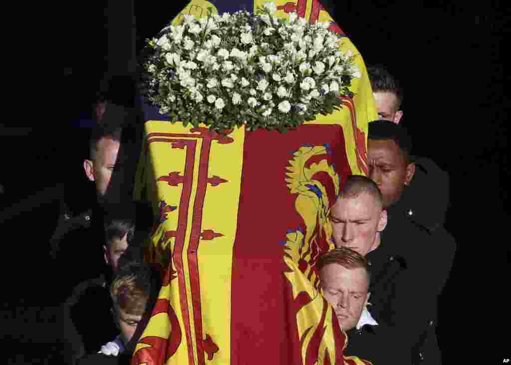 The coffin of Queen Elizabeth II is carried from St. Giles’ Cathedral in Edinburgh, Sept. 13, 2022.