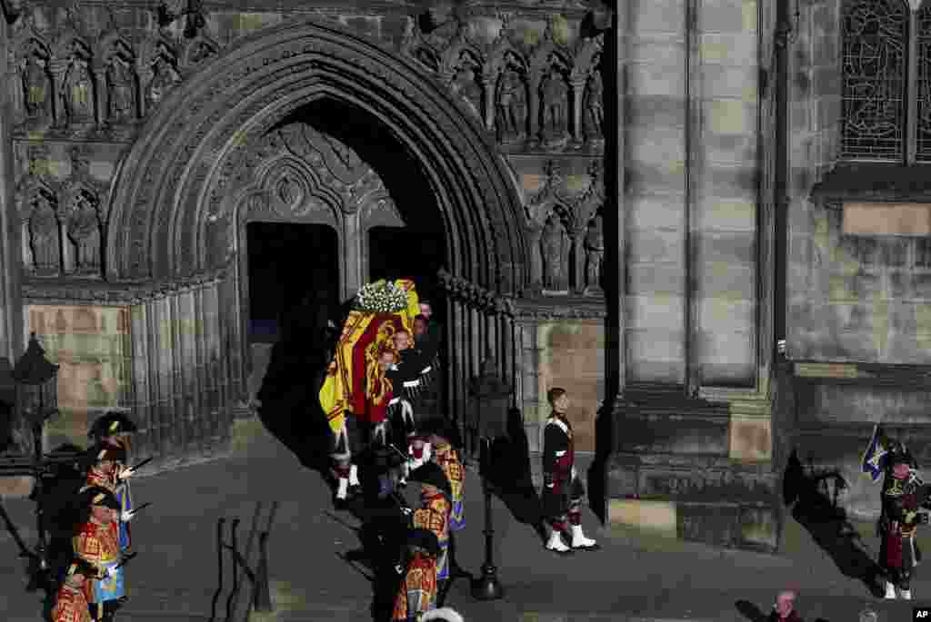 The coffin of Queen Elizabeth II is carried to the hearse from St. Giles’ Cathedral in Edinburgh, Sept. 13, 2022.