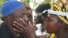 FILE - Residents are screened for trachoma, a neglected tropical disease and the world’s leading infectious cause of blindness, in a village in Mali, Jan. 23, 2017. (The Carter Center via AP)