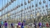 Birds sit in cages during a bird singing competition in Thailand's southern province of Narathiwat, Sept. 21, 2022.