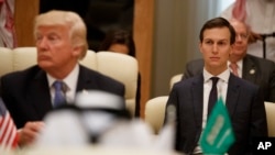 FILE - White House senior adviser Jared Kushner, right, looks on during a meeting between U.S. President Donald Trump, left, and leaders at the Gulf Cooperation Council Summit, at the King Abdulaziz Conference Center, in Riyadh, Saudi Arabia, May 21, 2017.