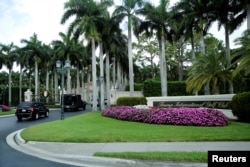 FILE - The motorcade of U.S. President Donald Trump arrives at Trump International Golf Club in West Palm Beach, Florida, April 15, 2017.