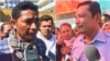 Phorn Mai (right), an official at the labor ministry's intervention office and Lanh Phirum, CUMW representative at the Southland factory, spoke to reporters outside the factory on June 9, 2017. (Hul Reaksmey/VOA Khmer)