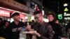 ‘We’re all family now’: Protesters Gather for Free Christmas Dinner in Hong Kong