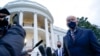 President Joe Biden talks to reporters on the South Lawn of the White House before boarding Marine One in Washington, Feb. 16, 2021. Biden is traveling to Milwaukee to participate in a town hall event. 