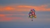Jonathan Trappe is seen flying is cluster balloon ship on September 12, 2013. (Paul Cyr Barcroft media)