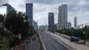 FILE - In this Jan. 11, 2013, photo, workers build an elevated highway in Jakarta, Indonesia. 