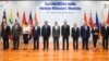 In this photo provided by Indian Foreign Minister S. Jaishankar's Twitter handle, Jaishankar, center, stands with Southeast Asian foreign ministers at the start of a meeting in New Delhi, India, Thursday, June 16, 2022.