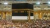 In this photo taken with low shutter speed, Muslim pilgrims circumambulate the Kaaba at the Grand Mosque, Mecca, Saudi Arabia, July 6, 2022. Muslims are converging on Mecca for the largest hajj since the coronavirus pandemic curtailed access.