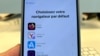 A pop-up message to choose a browser is displayed on the screen of an iPhone, in Brussels, Belgium, March 6, 2024. Europeans this week will get new choices for default browsers and search engines.