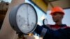 FILE - A pressure gauge is seen at a gas compressor station near Uzhhorod, western Ukraine, May 2014.