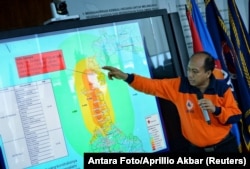 Sutopo Purwo Nugroho, a spokesman of Indonesia's disaster mitigation agency BNPB, holds a news conference to brief reporters on the latest situation after a strong quake and tsunami hit Sulawesi island, at the BNPB headquarters in Jakarta, Indonesia, Sept. 29, 2018.