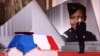 French President Emmanuel Macron pay respect to the cenotaph of Josephine Baker, covered with the French flag, at the Pantheon in Paris, France, Nov. 30, 2021, where she is to symbolically be inducted, becoming the first Black woman to receive France's highest honor. 