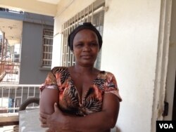 Vendor Isatu Sesay stands outside the Advocaid office in Freetown, Sierra Leone, June 1, 2015. ( VOA / N. deVries)