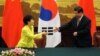 2013年6月27日韩国总统朴槿惠(左)和中国国家主席习近平在北京人民大会堂