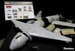 FILE - Remains of Iranian drones provided by the Pentagon are on display before U.S. Ambassador to the United Nations Nikki Haley briefs the media on highlights of the U.N.'s 2231 Implementation Report at Joint Base Anacostia-Bolling in Washington, Dec. 14, 2017.